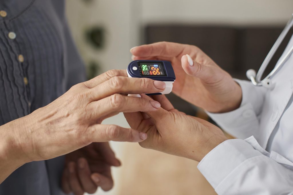 Doctor checking patient’s blood sugar for diabetes care at Ashtavinayak Multispeciality Hospital Panvel
